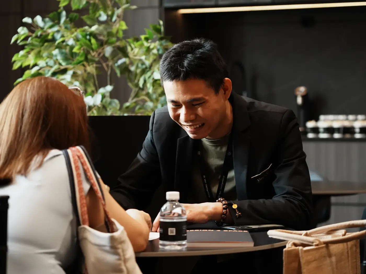 Designer sharing renovation ideas with a smiling couple