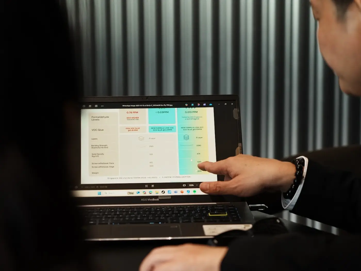 Designer walking a homeowner through a live itemised quotation on screen